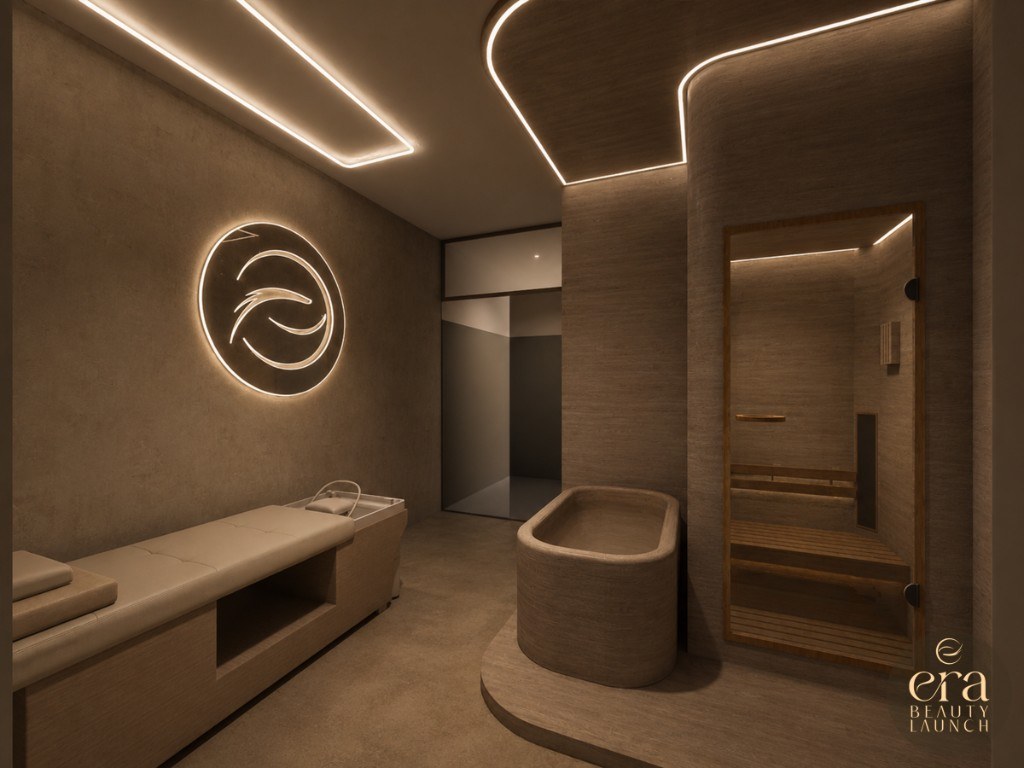ERA Beauty Launch treatment room with a spa bed, stone bath and glass sauna